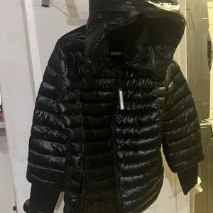 Calvin Klein size large women’s puffer jacket with hood new without tags